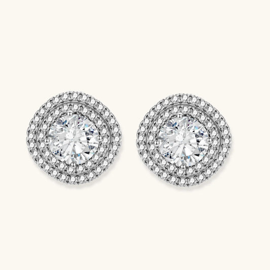 Double halo sterling silver stud earrings with brilliant round moissanite center stones and pavé crystal accents