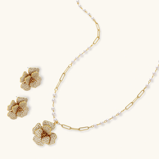 14K gold-plated flower jewelry set with zirconia crystals, featuring dimensional petal necklace and matching earrings
