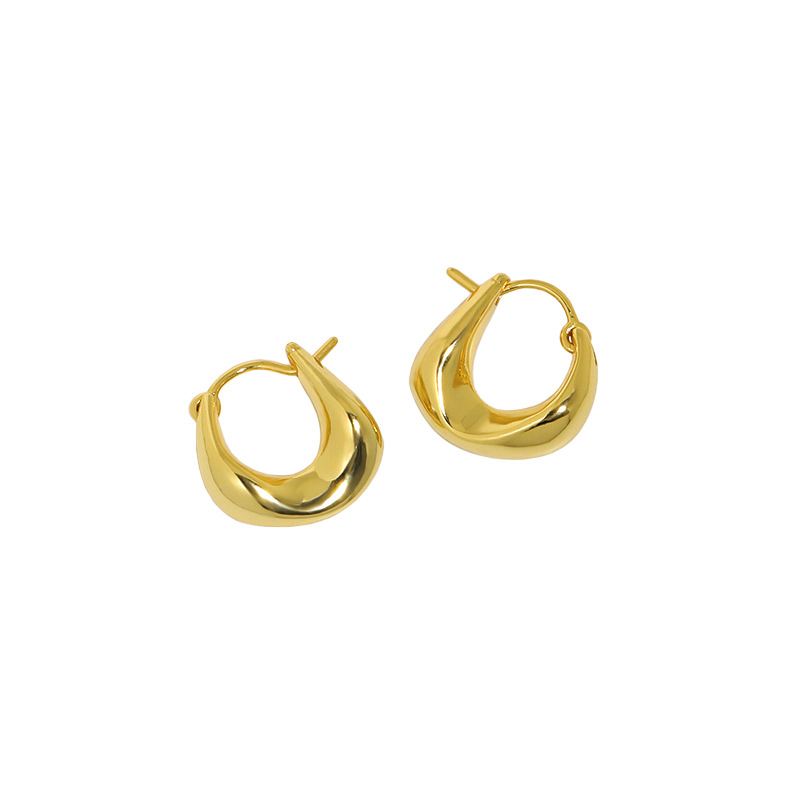 Curved Mini Hoop Earrings in 925 sterling silver. Compact curved hoops with a softly sculpted profile.