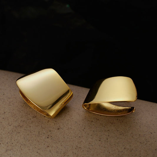 Folded Curve Stud Earrings in 925 sterling silver. Broad folded curves create an architectural polished stud.