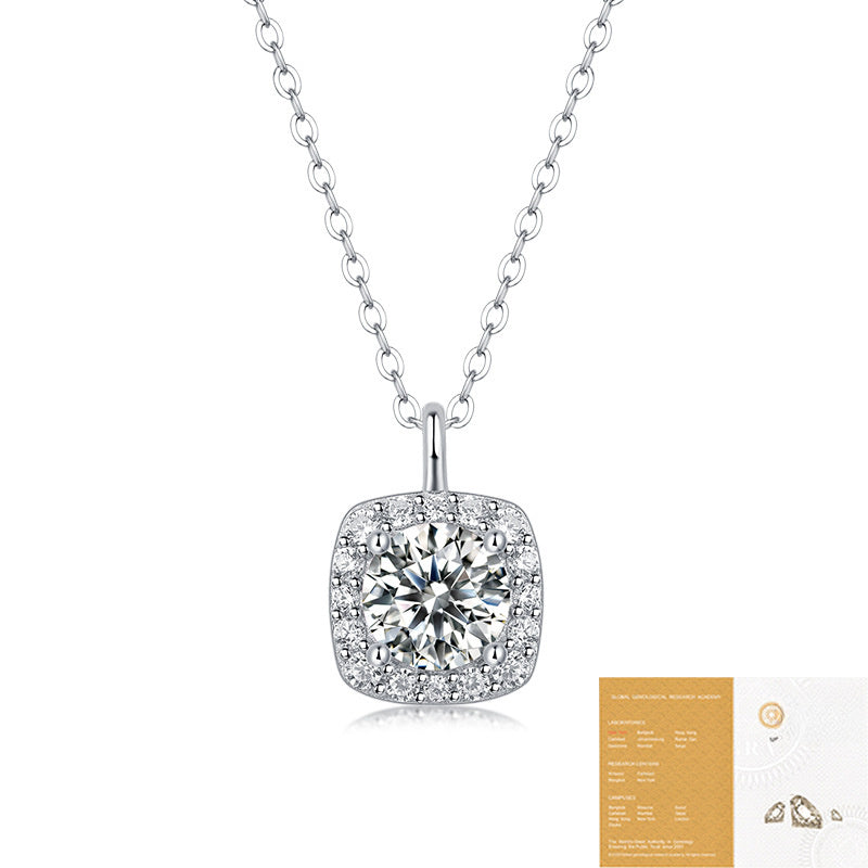Moissanite Cushion Halo Pendant Necklace in 925 sterling silver. A round moissanite centre in a cushion halo on a fine bead chain.
