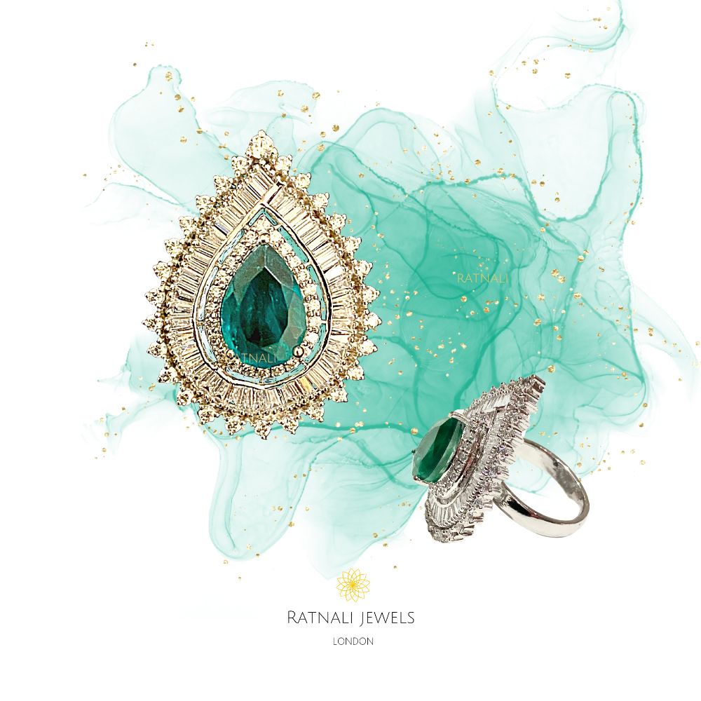 Pear-cut emerald cocktail ring with Diamond CZ in gold and rhodium plated silver