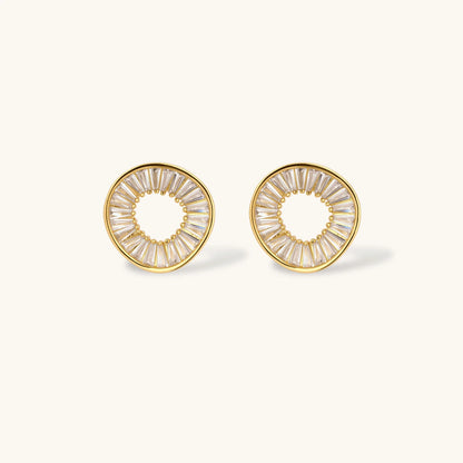 Gold-plated necklace and earring set with circular CZ crystal pendants featuring radial design on cream background