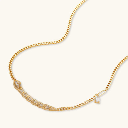 Gold-plated necklace with geometric diamond segments and matching huggie earrings featuring cubic zirconia details