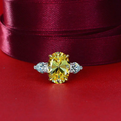 Yellow oval cut simulated diamond silver ring on red fabric - Ratnali Jewels