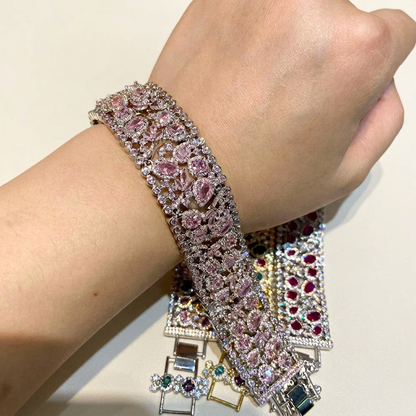 Pink cubic zirconia bracelet worn on a wrist