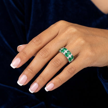 Emerald green eternity band silver ring on dark background - Ratnali Jewels