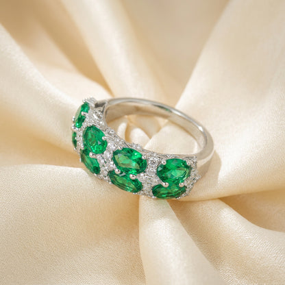 Emerald green eternity band silver ring, angled view - Ratnali Jewels