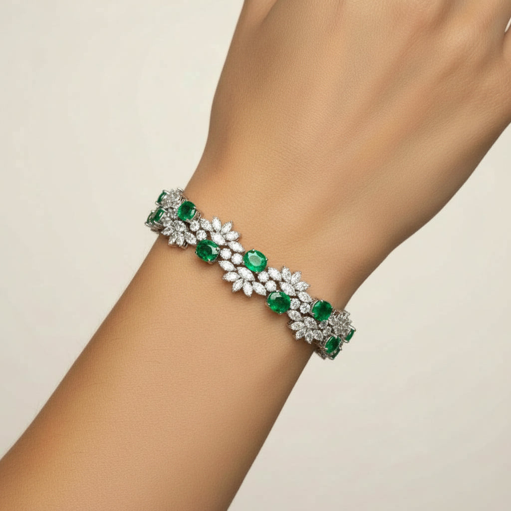 Floral Cluster Gemstone Tennis Bracelet with emerald stones worn on the wrist