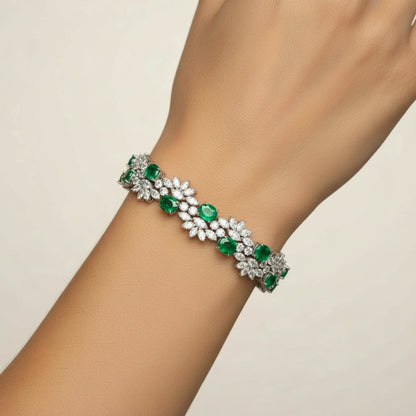 Floral Cluster Gemstone Tennis Bracelet with emerald stones worn on the wrist