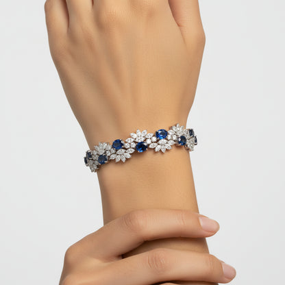 Floral Cluster Gemstone Tennis Bracelet with sapphire stones worn on the wrist