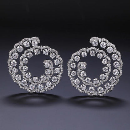 Swirl design statement earrings side view - Ratnali Jewels