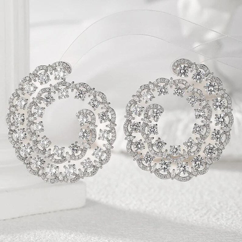 Swirl design statement earrings worn - Ratnali Jewels