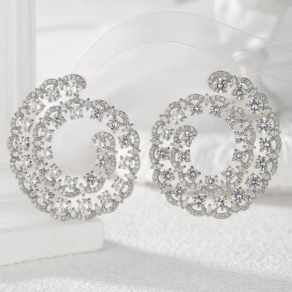 Swirl design statement earrings worn - Ratnali Jewels