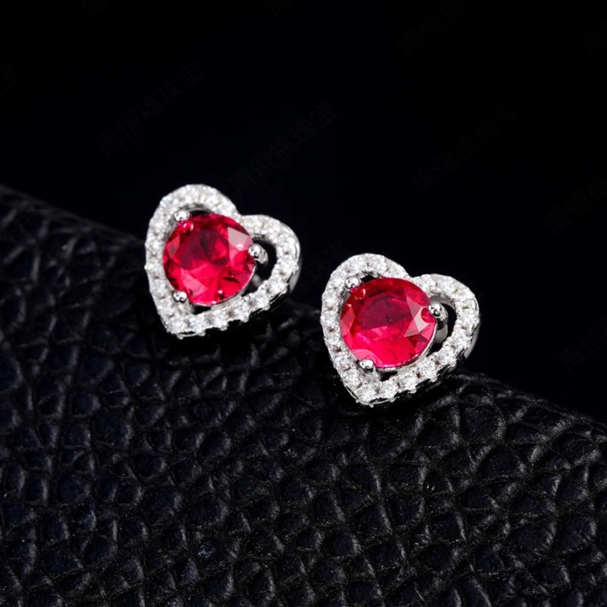Ruby heart halo stud earrings close up