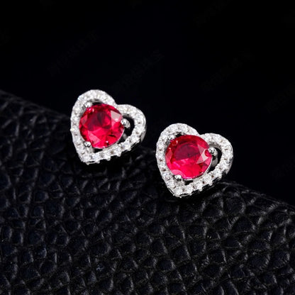 Ruby heart halo stud earrings close up
