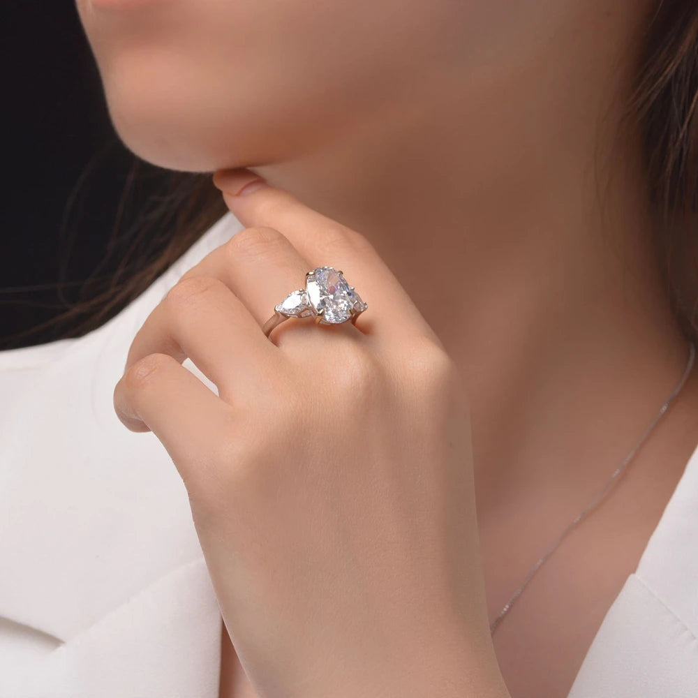 White oval cut simulated diamond silver ring worn on hand - Ratnali Jewels