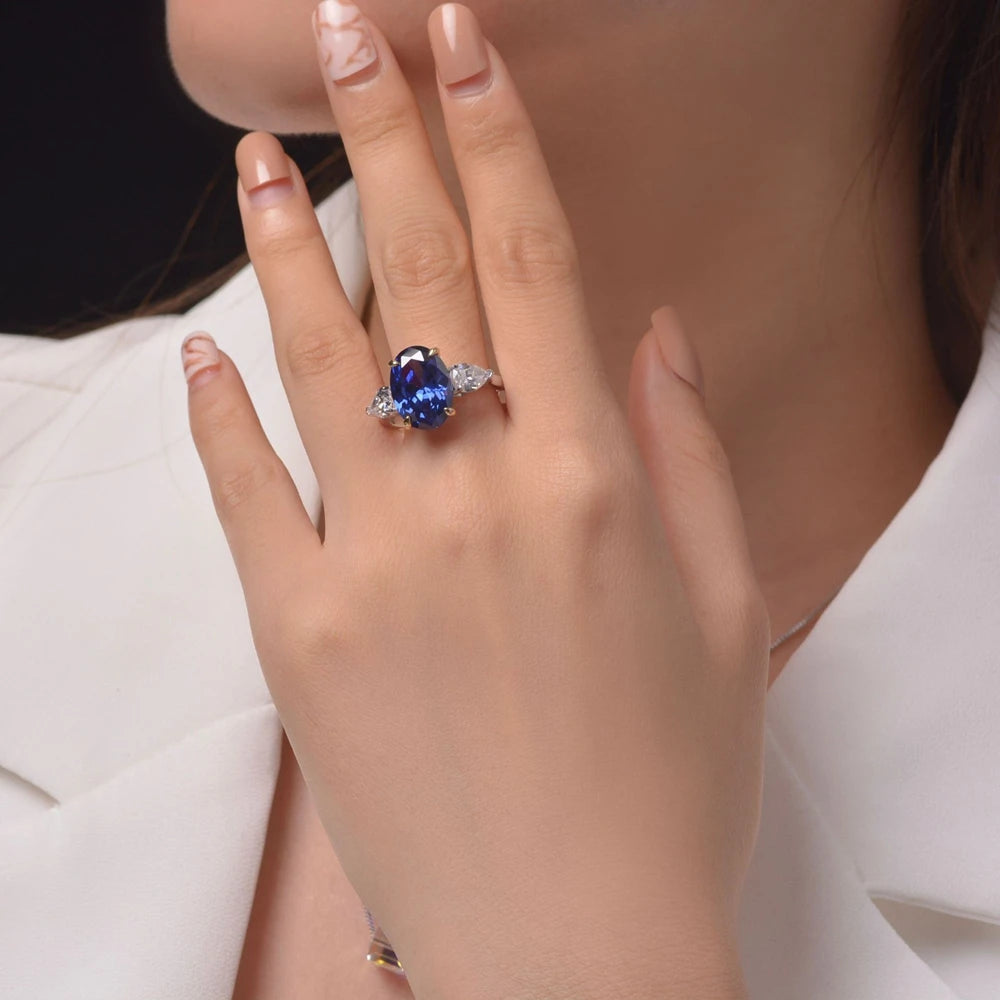 Blue oval cut simulated diamond silver ring worn on hand - Ratnali Jewels