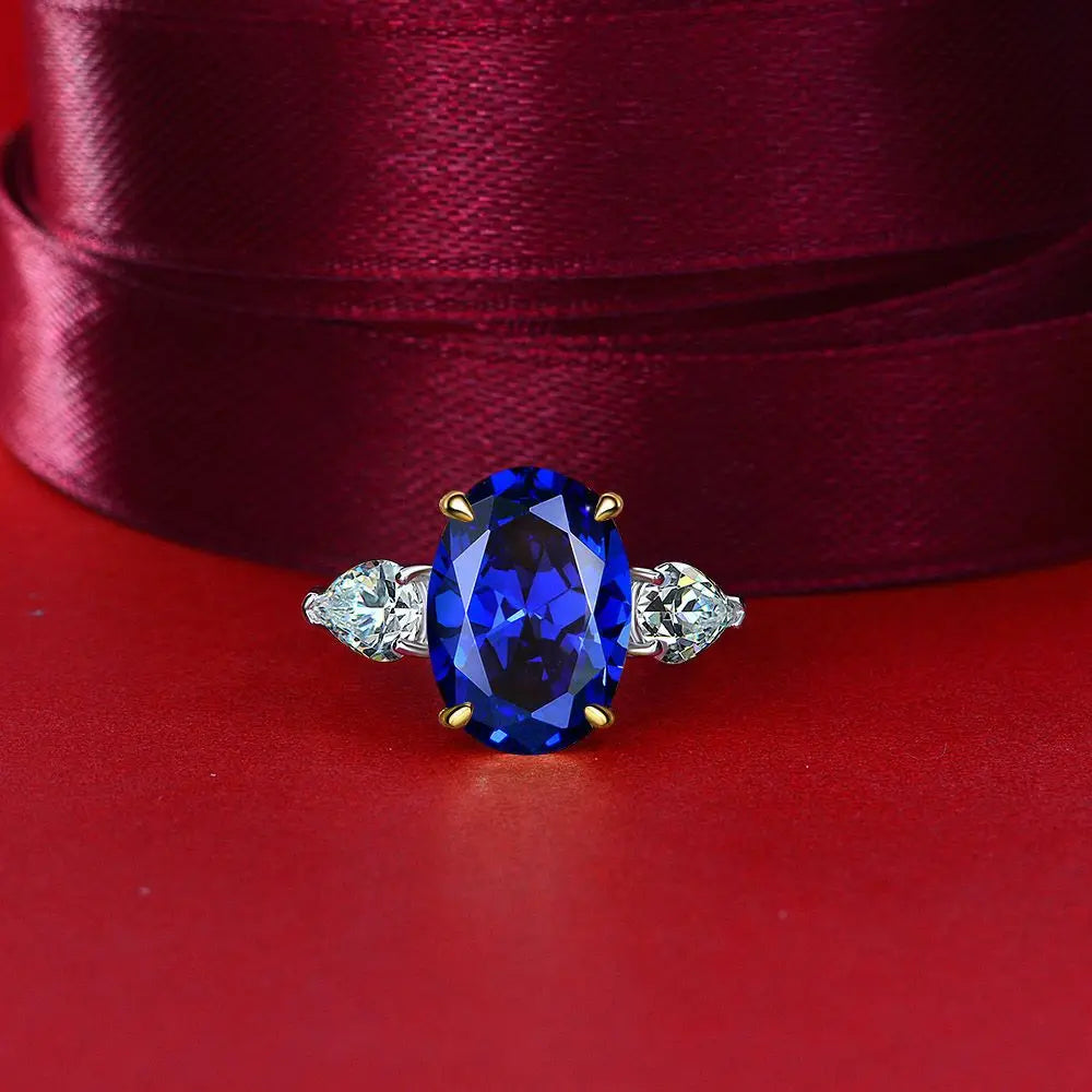 Blue oval cut simulated diamond silver ring on red fabric - Ratnali Jewels