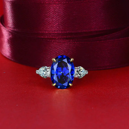 Blue oval cut simulated diamond silver ring on red fabric - Ratnali Jewels
