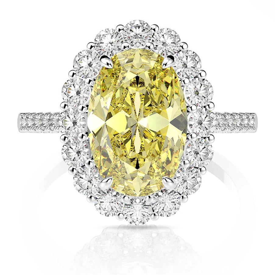 Yellow oval statement silver ring, close-up studio shot - Ratnali Jewels