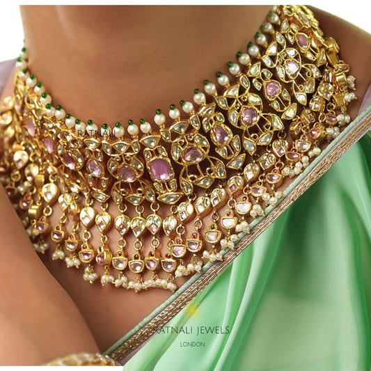 Pink tourmaline Polki bridal necklace set worn with green saree, handcrafted Indian bridal jewellery by Ratnali Jewels London