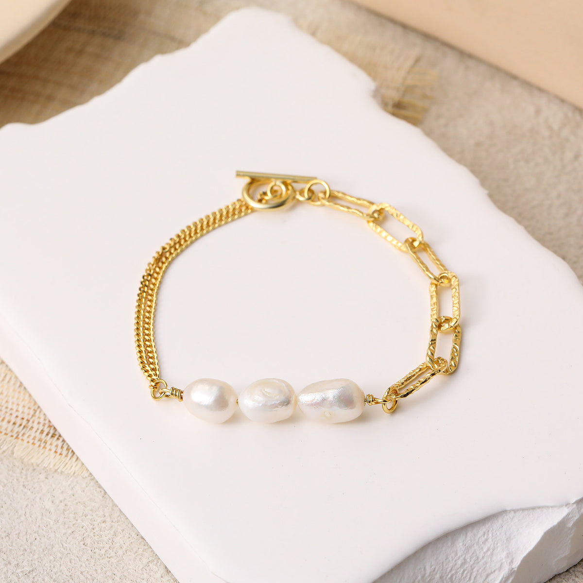 Baroque Pearl Mixed Link Bracelet in 925 sterling silver. Three baroque pearls meet contrasting links and a toggle clasp.