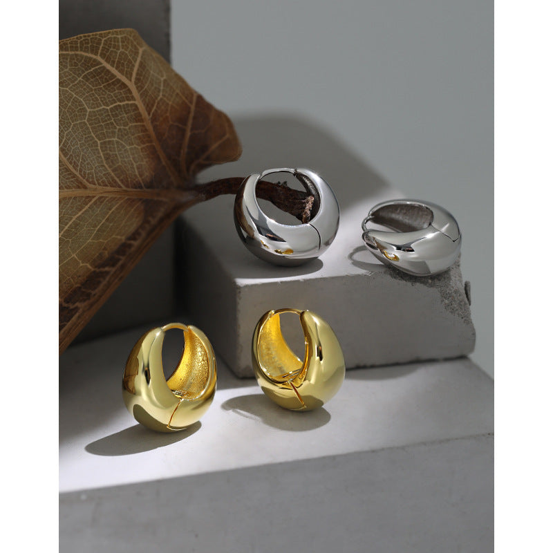Bold U Hoop Earrings in 925 sterling silver. Broad U curves and polished surfaces give these hoops presence.