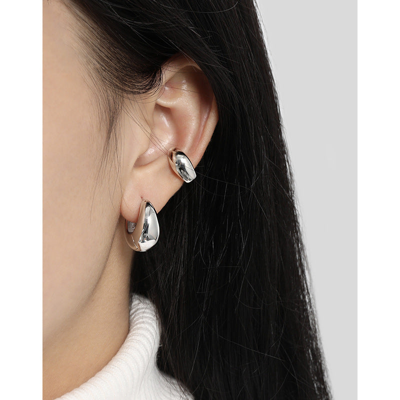 Bold U Hoop Earrings in 925 sterling silver. Broad U curves and polished surfaces give these hoops presence.