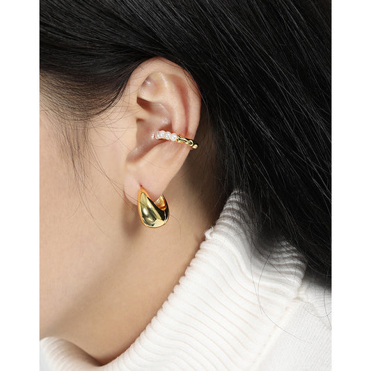 Bold U Hoop Earrings in 925 sterling silver. Broad U curves and polished surfaces give these hoops presence.