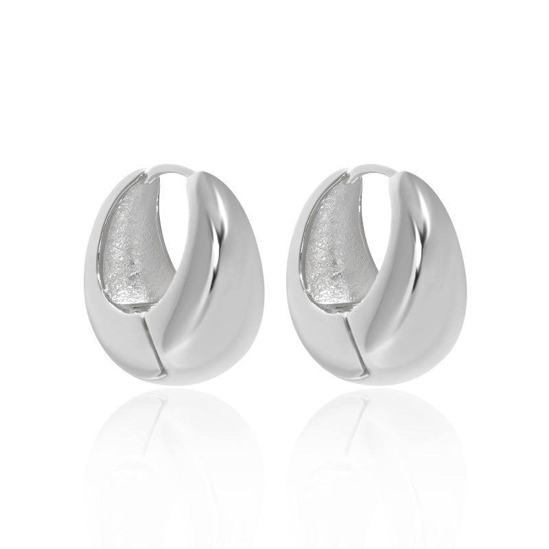 Bold U Hoop Earrings in 925 sterling silver. Broad U curves and polished surfaces give these hoops presence.