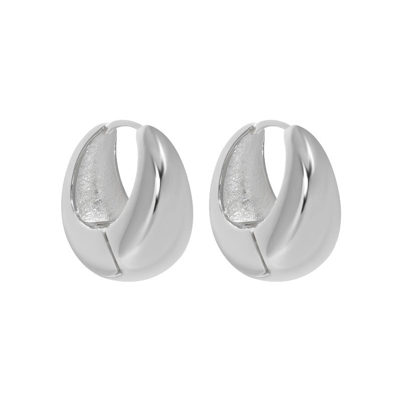 Bold U Hoop Earrings in 925 sterling silver. Broad U curves and polished surfaces give these hoops presence.