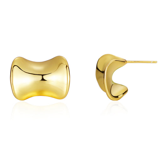 Concave Sculptural Stud Earrings in 925 sterling silver. Curved edges and dipped centres give polished studs a flowing shape.