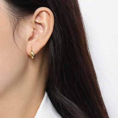 Curved Mini Hoop Earrings in 925 sterling silver. Compact curved hoops with a softly sculpted profile.