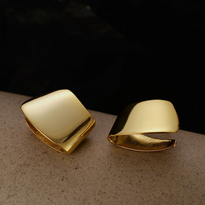 Folded Curve Stud Earrings in 925 sterling silver. Broad folded curves create an architectural polished stud.