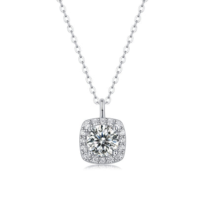 Moissanite Cushion Halo Pendant Necklace in 925 sterling silver. A round moissanite centre in a cushion halo on a fine bead chain.