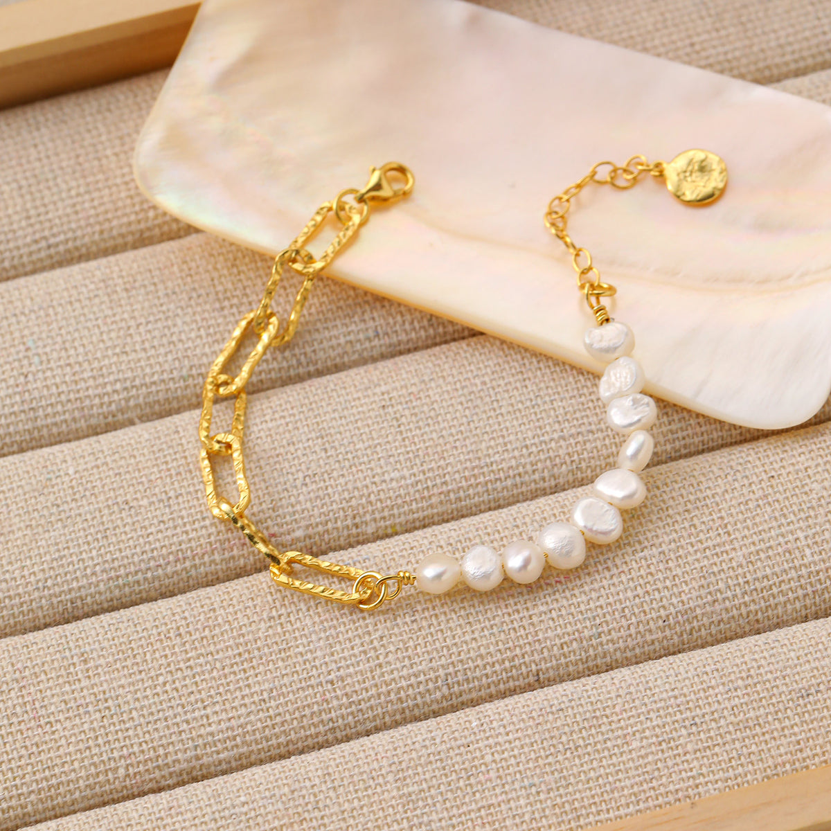 Pearl and Paperclip Chain Bracelet in 925 sterling silver. A pearl row meets open paperclip links in an asymmetric bracelet.