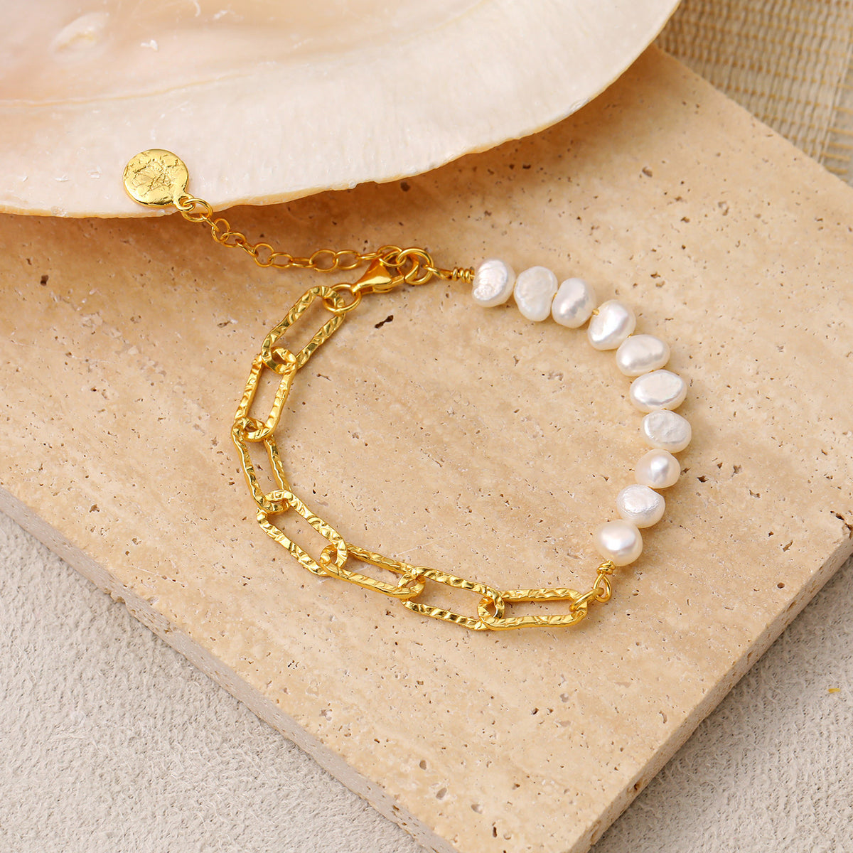 Pearl and Paperclip Chain Bracelet in 925 sterling silver. A pearl row meets open paperclip links in an asymmetric bracelet.