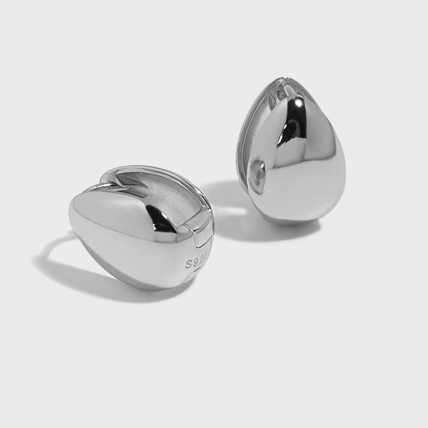 Petite Teardrop Hoop Earrings in 925 sterling silver. Petite teardrop hoops with smooth curves and compact proportions.