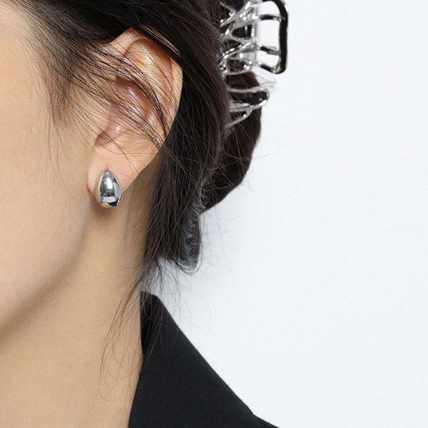 Petite Teardrop Hoop Earrings in 925 sterling silver. Petite teardrop hoops with smooth curves and compact proportions.