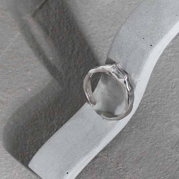 Rectangle Accent Open Ring in 925 sterling silver. A rectangular cubic zirconia accents a textured adjustable band.