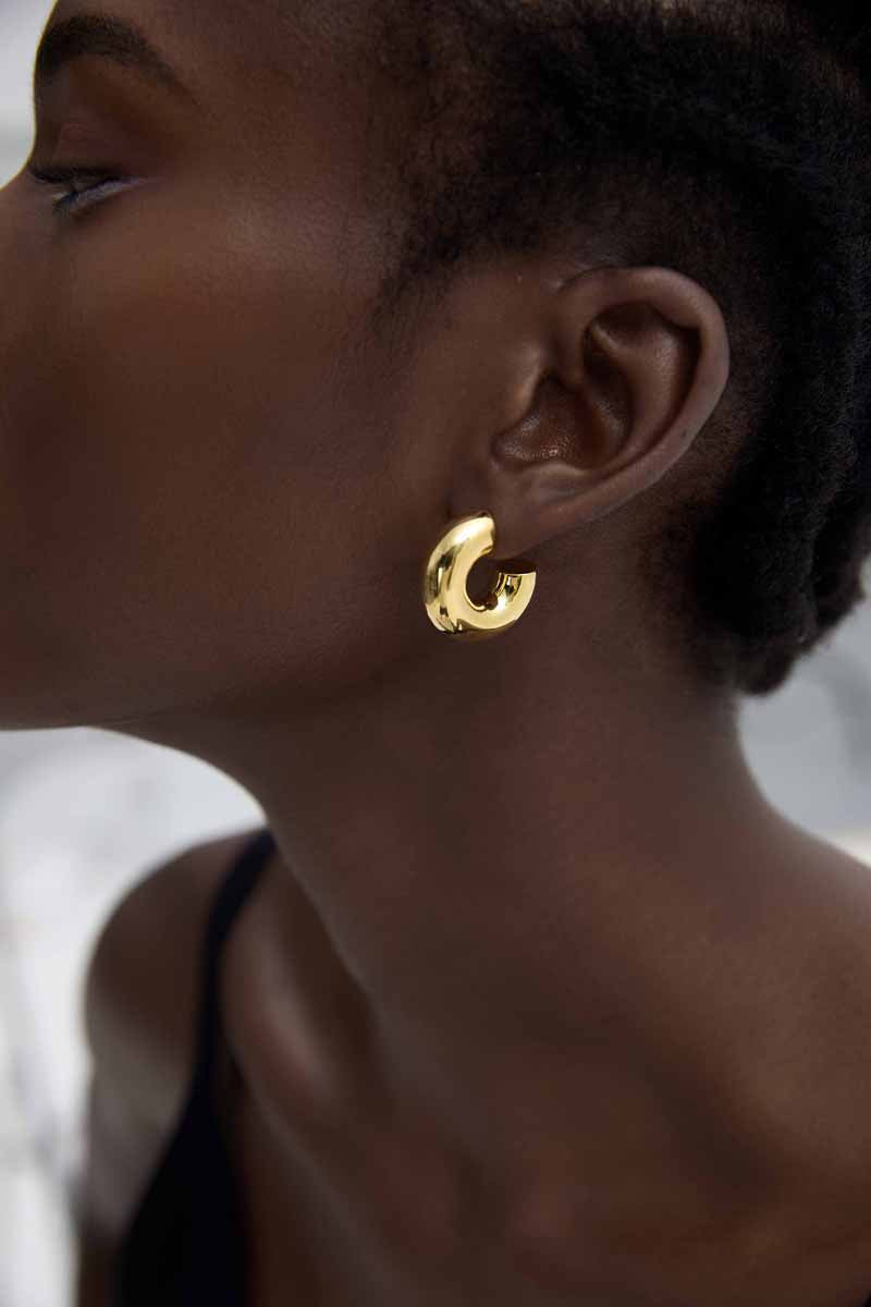 Rounded C Hoop Earrings in 999 fine silver. A tubular profile forms an open C with soft rounded edges.