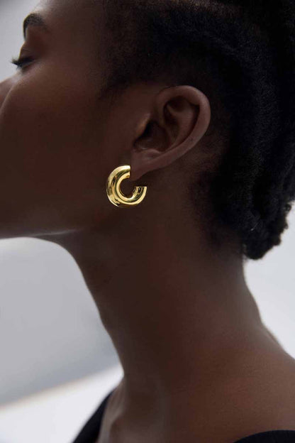 Rounded C Hoop Earrings in 999 fine silver. A tubular profile forms an open C with soft rounded edges.