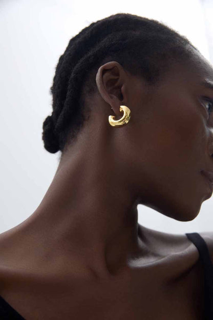 Rounded C Hoop Earrings in 999 fine silver. A tubular profile forms an open C with soft rounded edges.