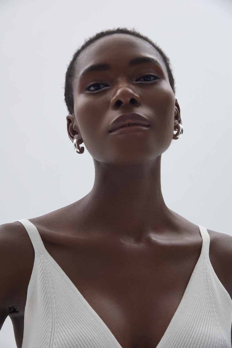 Rounded C Hoop Earrings in 999 fine silver. A tubular profile forms an open C with soft rounded edges.
