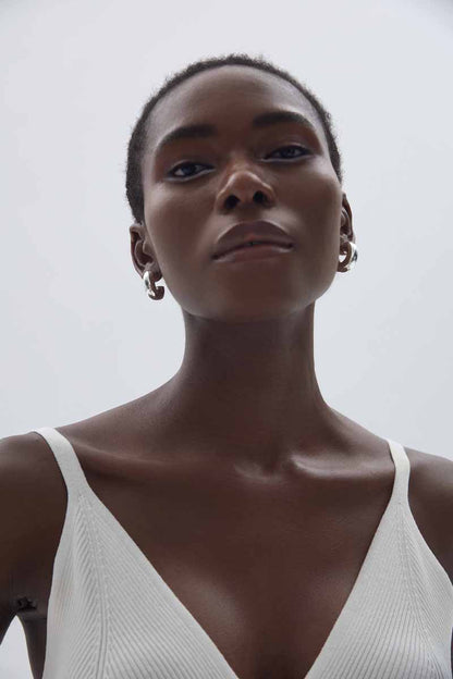 Rounded C Hoop Earrings in 999 fine silver. A tubular profile forms an open C with soft rounded edges.