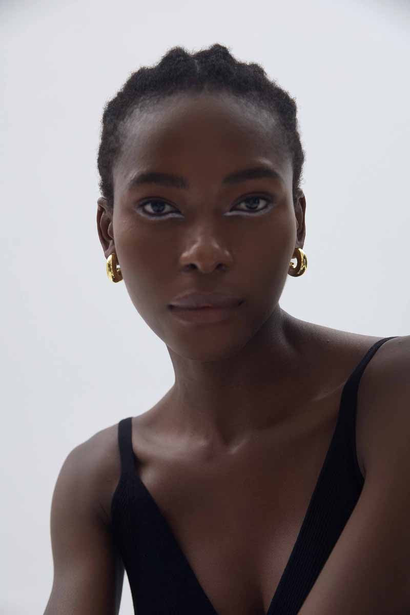 Rounded C Hoop Earrings in 999 fine silver. A tubular profile forms an open C with soft rounded edges.