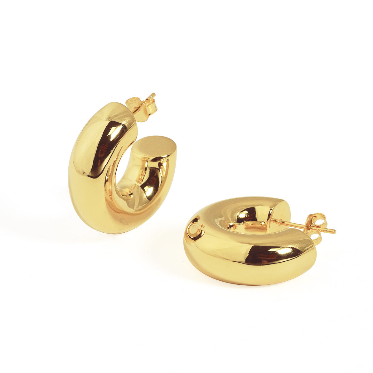 Rounded C Hoop Earrings in 999 fine silver. A tubular profile forms an open C with soft rounded edges.