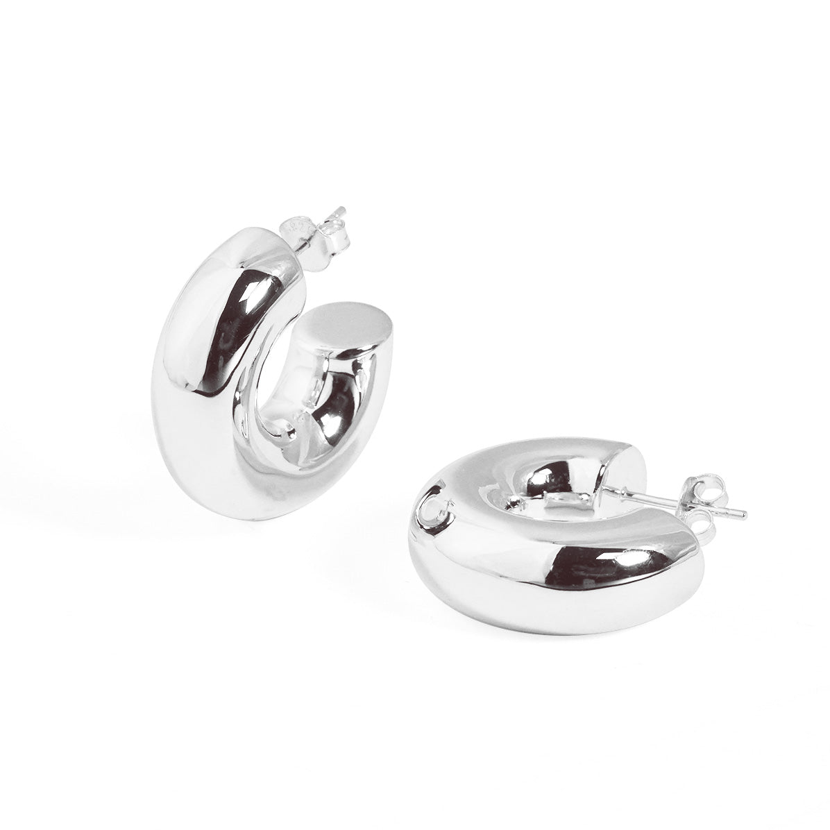 Rounded C Hoop Earrings in 999 fine silver. A tubular profile forms an open C with soft rounded edges.