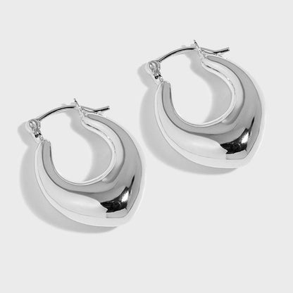 Rounded U Hoop Earrings in 925 sterling silver. Full rounded U curves bring a sculptural finish to everyday hoops.